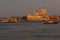 Basilica di Santa Maria della Salute at orange colors reflected on the water surface, Venice, Italy Royalty Free Stock Photo