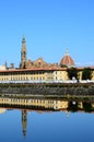 The Basilica of the Holy Cross and the Cathedral of Santa Maria del Fiore reflected in the river Arno in Florence