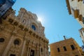 Basilica of holy cross or santa croce in central part of Lecce, Apulia, Italy. Beautiful basilica church lit by sun. Visible lens Royalty Free Stock Photo