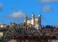 Basilica of Notre-Dame de Fourviere of Virgin Mary with Ferris wheel, landmarks of Lyon and Fourviere hill, France Royalty Free Stock Photo