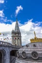 Basilica of our Lady of the Rosary and flags of different countries against the blue sky. Lourdes, France Royalty Free Stock Photo