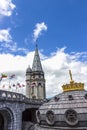 Basilica of our Lady of the Rosary and flags of different countries against the blue sky. Lourdes, France Royalty Free Stock Photo
