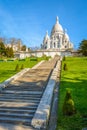 The basilica of the Sacred Heart of Paris and the stairway in the Louise Michel park
