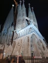 Basilica the Sagrada FamÃ­lia at night with black sky background.