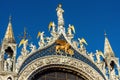 Basilica of Saint Mark or San Marco close-up, beautiful rooftop in blue sky, Venice, Italy. Old cathedral is top landmark of