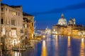 Basilica Santa Maria della Salute, Punta della Dogona and Grand Canal at blue hour sunset in Venice, Italy with reflections. Royalty Free Stock Photo