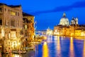 Basilica Santa Maria della Salute, Punta della Dogona and Grand Canal at blue hour sunset in Venice, Italy with reflections