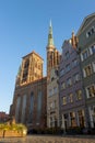 Basilica of St Mary in the old street with nearby buildings in Gdansk, Poland