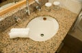 Basin and granite vanity in bathroom