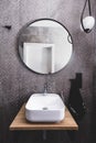 Basin and round mirror in a modern new luxury bathroom Royalty Free Stock Photo