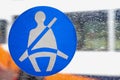 Basingstoke, UK - Jan 09 2016: Fasten seatbelt sign on the window of a public transport bus Royalty Free Stock Photo