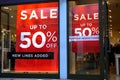 Basingstoke, UK - January 04 2017: Shop fronts of UK fashion stores with 50% off Sale signs