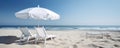 peaceful scene with two beach chairs and umbrellas overlooking the calm ocean Royalty Free Stock Photo