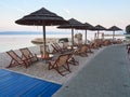 Baska Voda, Croatia - July 24, 2021: Beach bar with sunbeds and umbrellas in the seaside resort of Baska Voda.