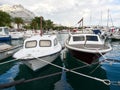 Baska Voda, Dalmatia, Croatia - July 19, 2021: Rainbow over the city. View of the promenade, marina and Biokovo Mountains