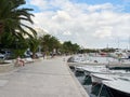 Baska Voda, Dalmatia, Croatia - July 19, 2021: Rainbow over the city. View of the promenade, marina and Biokovo Mountains