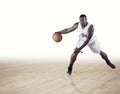 Basketball Player dribbling on a hardwood court Royalty Free Stock Photo