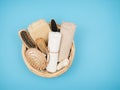 Basket accessories for body care on the blue background