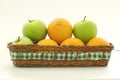 A basket apples and oranges Royalty Free Stock Photo