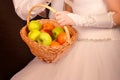 Fruit basket in the hands of the bride Royalty Free Stock Photo