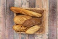 Basket of assorted breads. Village bread, rye bread, onion