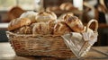 Basket of assorted freshly baked bread in a rustic kitchen, cozy and inviting atmosphere Royalty Free Stock Photo