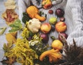 Basket with autumn vegetables and flowers.