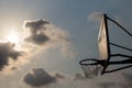 Basket ball board under sky with white clouds. Basketball court with old backboard. sky and white clouds on background. Royalty Free Stock Photo