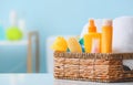 Basket with bath accessories for baby on table in bathroom Royalty Free Stock Photo