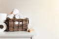 Basket with bathroom accessories. A set of rolled towels. Hotel cleaning concept