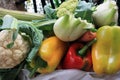 Basket of beautiful colorful healthy vegetables, red and yellow peppers, raw cabbage and cabbage fennel Royalty Free Stock Photo