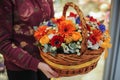 Basket with a bouquet of colorful flowers
