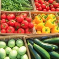 basket brims with organic tomatoes, cucumbers eggplants Supermarket display