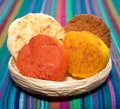 Basket with a bunch of typical mexican coconut candies honey cocada traditional mexican flag carpet background isolated colors