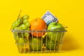 basket cart supermarket with fruit and dollar bill