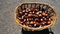 A basket of chestnuts on a table