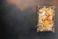 basket of chicken eggs on a dark background. top view Royalty Free Stock Photo