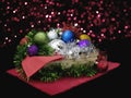 Basket of Christmas decorative festive balls, baubles with tinsel and bokeh effect.