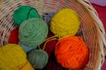 Basket of colorful, naturally dyed wools of Peru