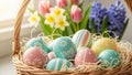 Basket of colorful painted Easter eggs with flowers in background Royalty Free Stock Photo
