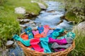 basket of colorful socks and undergarments by a gentle spring