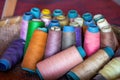 A basket of cotton thread spools of various colors in a Chinese tailor shop Royalty Free Stock Photo