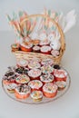 basket with decorated eggs and Easter cakes or muffins on the table. Royalty Free Stock Photo