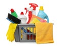 Basket with different cleaning products and tools on white background Royalty Free Stock Photo