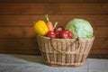 Basket with different fresh farm vegetables. View with copy cpace