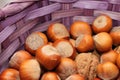 Hazelnuts and walnuts in the beautiful lilac basket Royalty Free Stock Photo