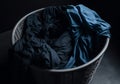 Basket with dirty black laundry. Sorting clothes for washing. Cleaning, housework. generative ai
