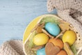 Basket with Easter colored eggs and cookies