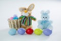 Basket with Easter eggs and two toy Easter bunny Royalty Free Stock Photo