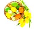 Basket with easter eggs and yellow tulips, Royalty Free Stock Photo